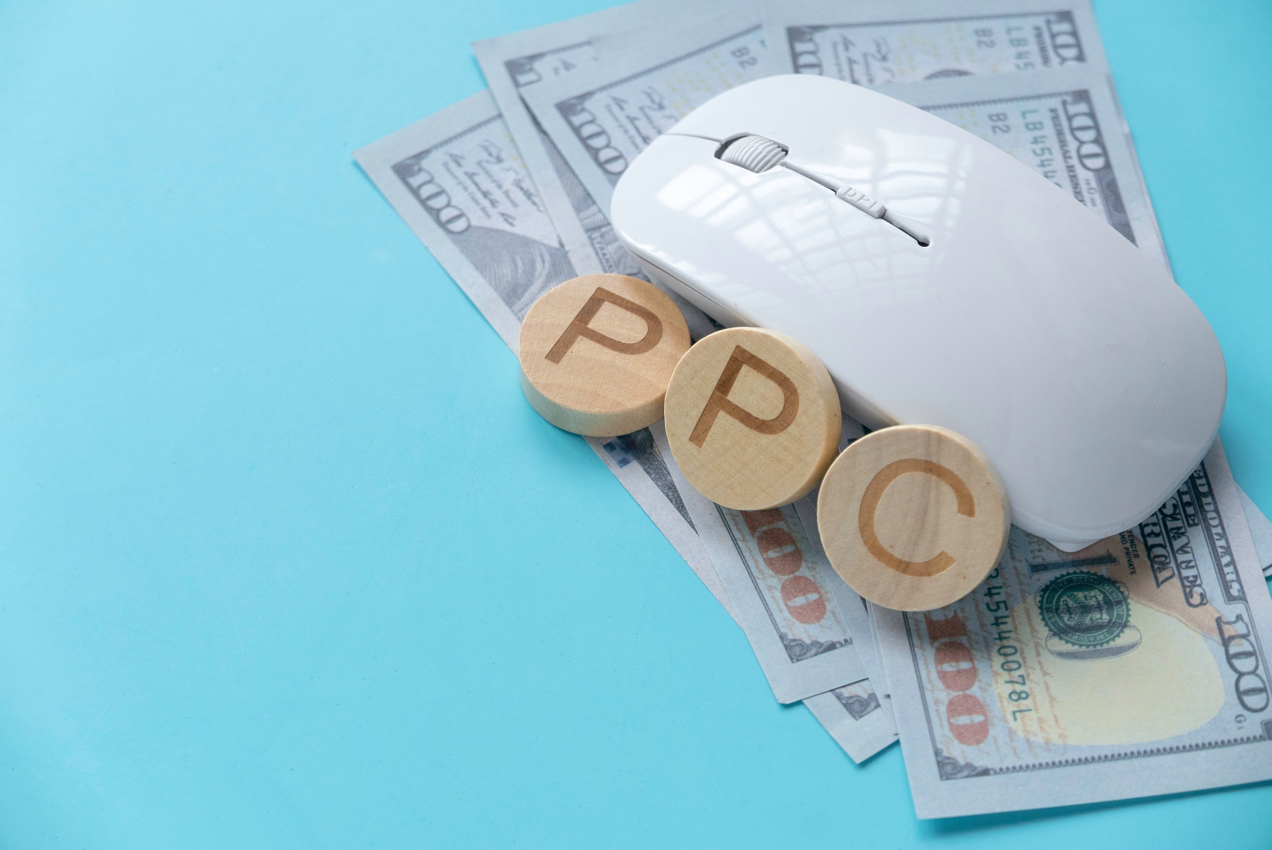 pay-per-click-concept-computer-mouse-over-a-dolla-2025-01-08-15-22-18-utc